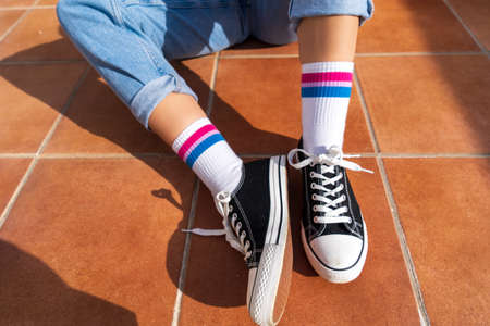 Woman with bisexual flag on her socksの写真素材