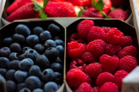 Delicious and healthy box of strawberries, blueberries and raspberriesの写真素材