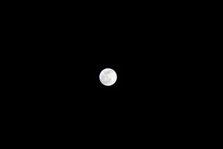 Bright full moon in the darkの写真素材