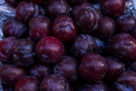 Close-up plums in a food marketの写真素材
