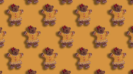 Pattern of bear ginger cookies on yellow background. Christmas wallpaperの写真素材