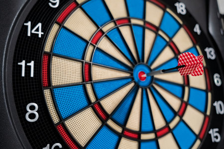 Single red dart on dartboard bullseye. Victory Conceptの写真素材