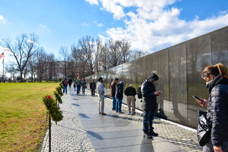 Vietnam Veterans Memorial. The wall in black granite engraved with the names of Vietnam Veterans. Washington DC, USA.のeditorial素材