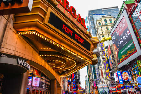 New York, USA Manhattan. Times Square crowds and traffic in the evening with Broadway Theaters and animated LED signs.のeditorial素材