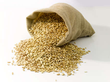Bag of burlap filled with cereal.の写真素材