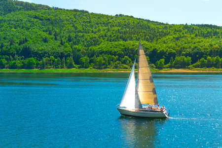 Sailing yacht against the backdropの写真素材