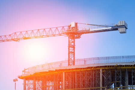 Crane and building under constructionの写真素材