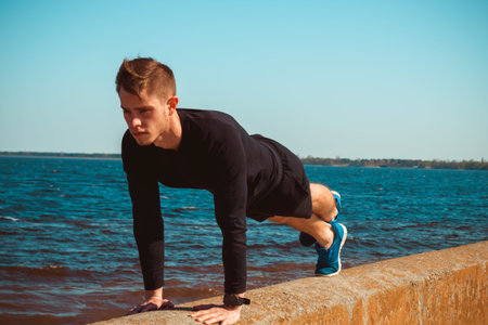 Outdoor photo of a purposeful sportive man