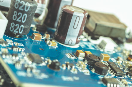 Electronic components, chips and capacitors on the blue pcb, close up view. Technology concept