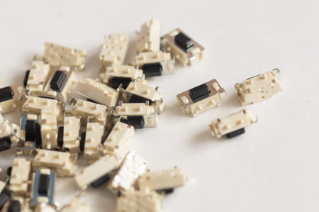 PCB micro contact switch, insulated on white backgroundの写真素材