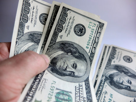 Close-up cash, 100 hundred dollar bills, 50 dollar bills, 20 dollar bills