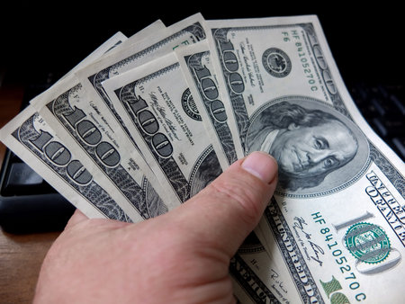 Close-up cash, 100 hundred dollar bills, 50 dollar bills, 20 dollar bills