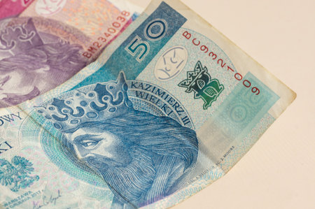 Banknotes, Polish currency, money, pack of banknotes. Close-up of banknotes on light background