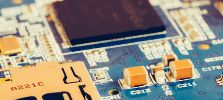 Electronic components, chips and capacitors on the blue pcb, close up view. Technology conceptの写真素材