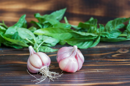 Close-up of garlic lying on a wooden backgroundの写真素材