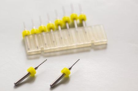 Set of micro drill bits, color coded in plastic box. For drilling mechanics electronics, pcb etc.