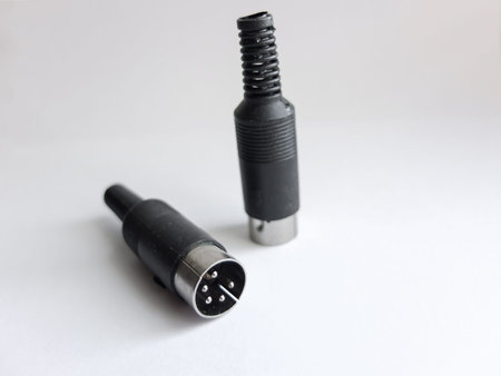 Audio plug 5 pins close-up on light background