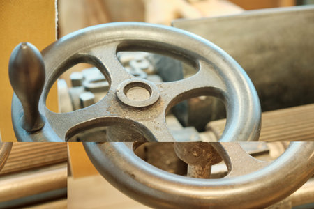 A close-up of the flywheel of an industrial steam engine