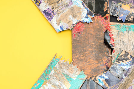 Broken colourful skateboard decks stacked on top of each other, skateboard recycling
