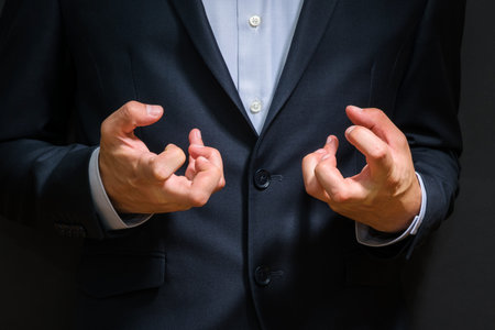 Business man fists clenched in anger. Annoying emotions at work