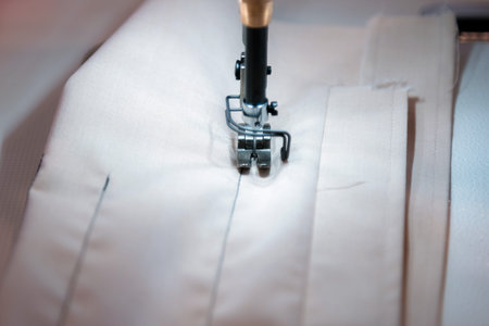 Close up of modern sewing machine and item of clothing, old sewing machine, vintage style