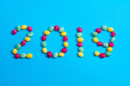 New years 2019. Pile of delicious colorful chewing candies background. Colourful sweets with space for your textの写真素材