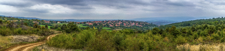 Panoramic view over rural bulgarian village and mountains in the backgroundの写真素材