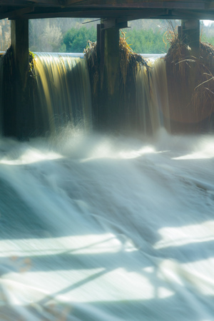Long exposure water fall in the dam, high tide, rising water, flowing water stream, floodの写真素材