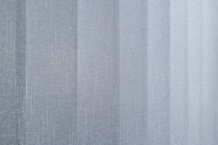 Close-up view of fabric curtain made of dense fabric in the corpora office. Textured abstract...