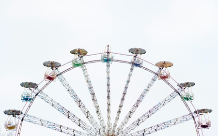 Vintage ferris wheel. Colourful old carousel at circus with copy space for text.の写真素材