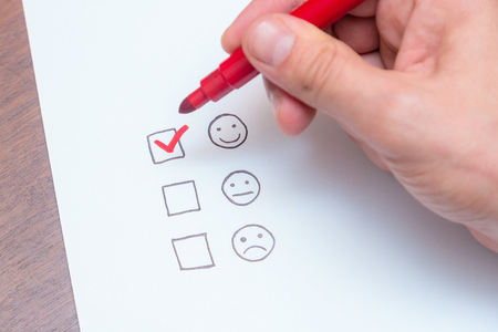 Human hand, tick placed on excellent check box. Customer service, satisfaction, survey formの写真素材