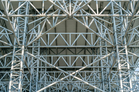Warehouse metal roofing, Large steel roof structure, bottom view with commercial factory building...
