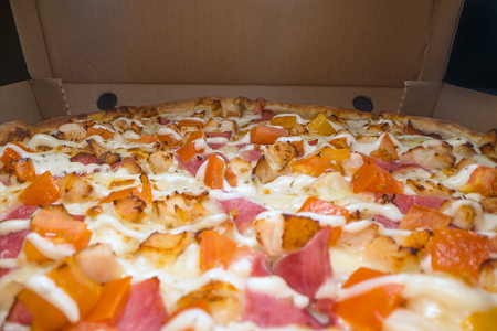 Inside of a Pizza box. Classic pizza in a cardboard box. Wide angle view from above. Pizza delivery, menu. Fast food, crusty doughの写真素材