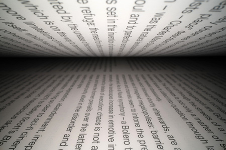 Inside the book concept. Latin letters and words on an open book with black dramatic background. Education, knowledge conceptの写真素材