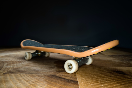 Fingerboard. A small skateboard for kids and teenagers to play with hand fingers. Youth culture, extreme sportの写真素材