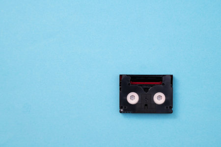 Vintage mini DV cassette tape used for recording video back in a day. Plastic, magnetic, analog film...