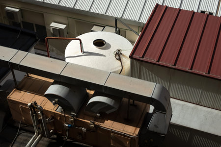 Industrial air conditioning system outside the hotel. Big air cooler device outdoors. Hear and cold controling machineの写真素材