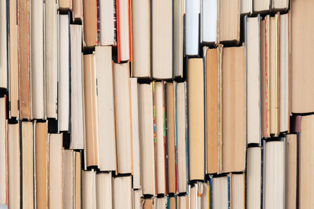 Vintage book background. Old and used hardback books stacked next to each other. Concept of education and studying. Nobodyの写真素材