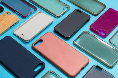 Pile of multicolored plastic back covers for mobile phone. Choice of smart phone protector...