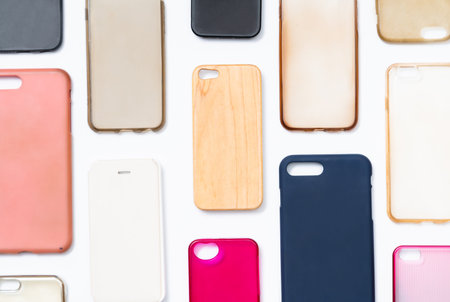 Pile of multicolored plastic back covers for mobile phone. Choice of smart phone protector...