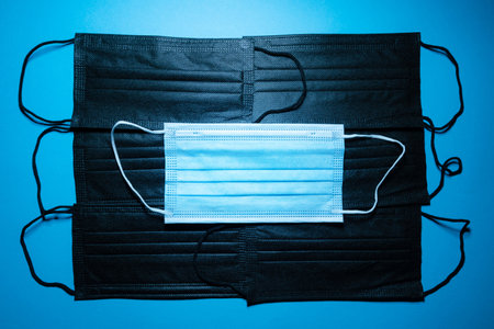 Blue medical face mask texture. Close up of surgical mask fabric with space for text.の写真素材