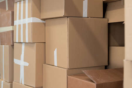 Stack of cardboard boxes ready to be shipped of a warehouse. Package storage room.の写真素材