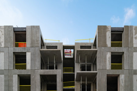 Structure of an apartment block at construction site. Housing development project.