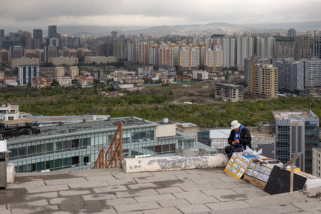 Ulaanbaatar, Mongolia - September, 2022 - person selling souvenirs for tourists by Memorial to Soviet soldiers on Zaisan Tolgoi hillのeditorial素材
