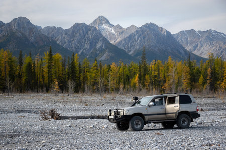 Khovsgol, Mongolia - September, 2022 - SUV car driving into hunting expedition through Mongolian wilderness.のeditorial素材