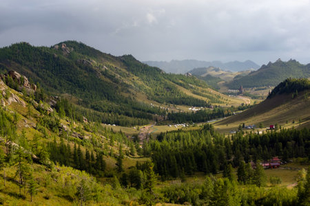 Terelj national park landscape, mountain ridge in Mongolia. Overview of the valley with the dramatic sky in the background.の写真素材