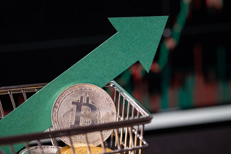 Buying crypto currency on an exchange. Building long term Bitcoin position. Shopping cart on black background.の写真素材