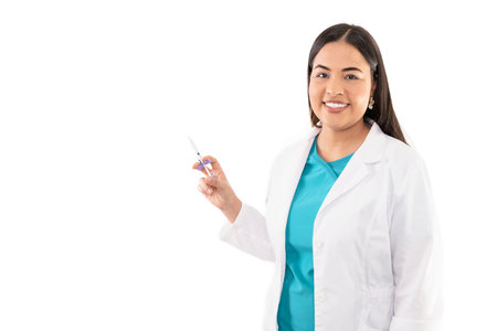 Cheerful female aesthetic clinic with syringe isolated on white backgroundの写真素材