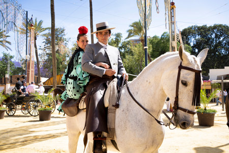 Jerez, Spain; May 07 2023: Spanish riders in Feria de Jerez dressed in the typical dress with their horses. Feast and joy in Jerez.のeditorial素材