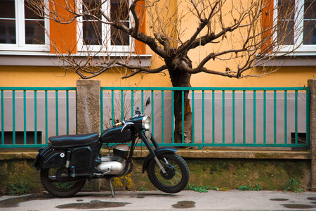 Slovakia, Bratislava, 11 march 2020 beautiful old Motorbike standing near nice buildingのeditorial素材
